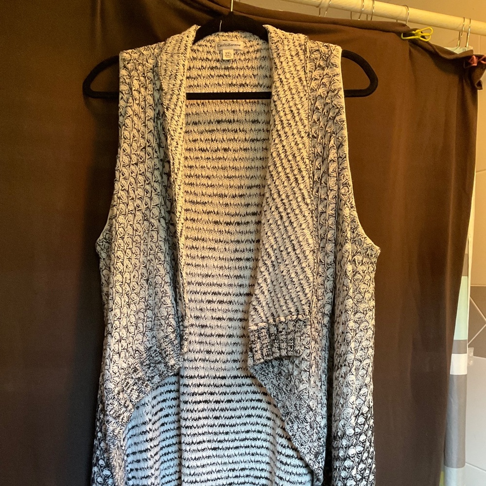 Knit open front sweater vest.